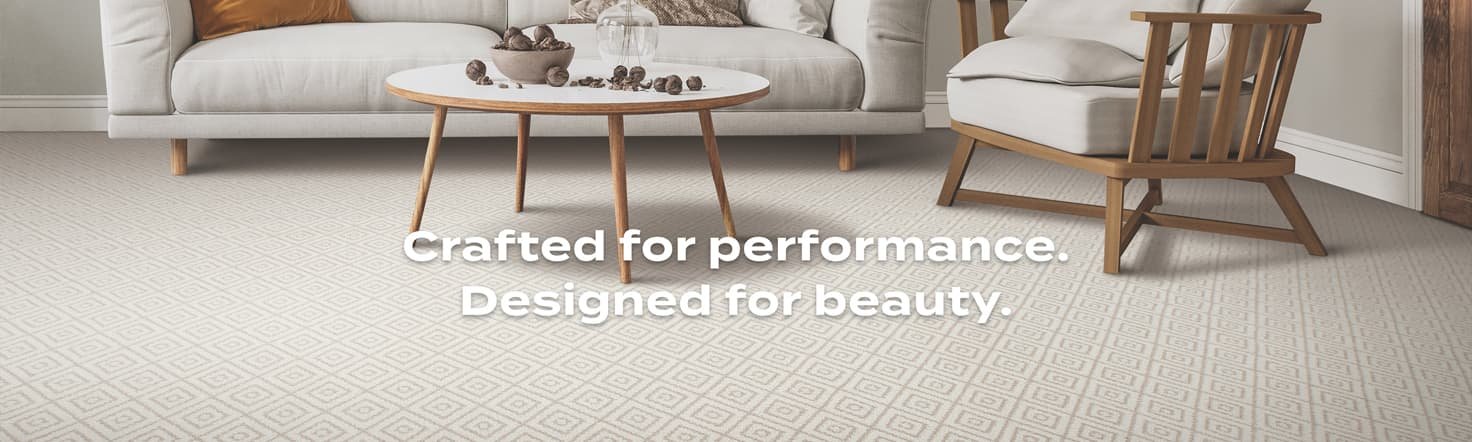 Godfrey Hirst EverLux Nylon Carpet in a bright living room with text "Crafted for performance. Designed for beauty."